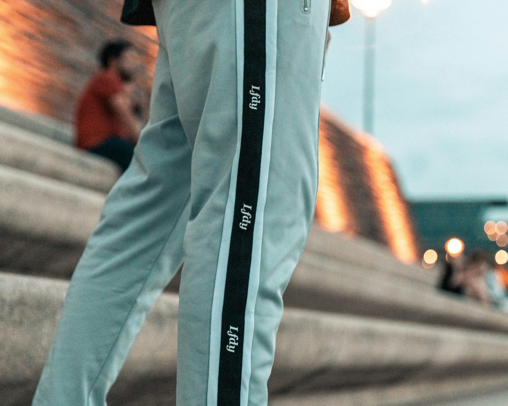 person in black and white long sleeve shirt and gray pants